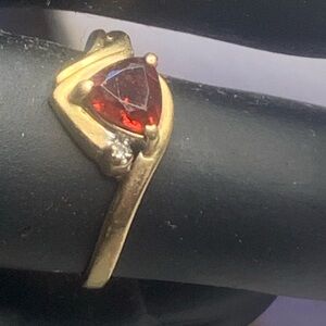 10k Solid Gold Love Story Ring Red Trillion cut Garnet & Diamond. Band bent some